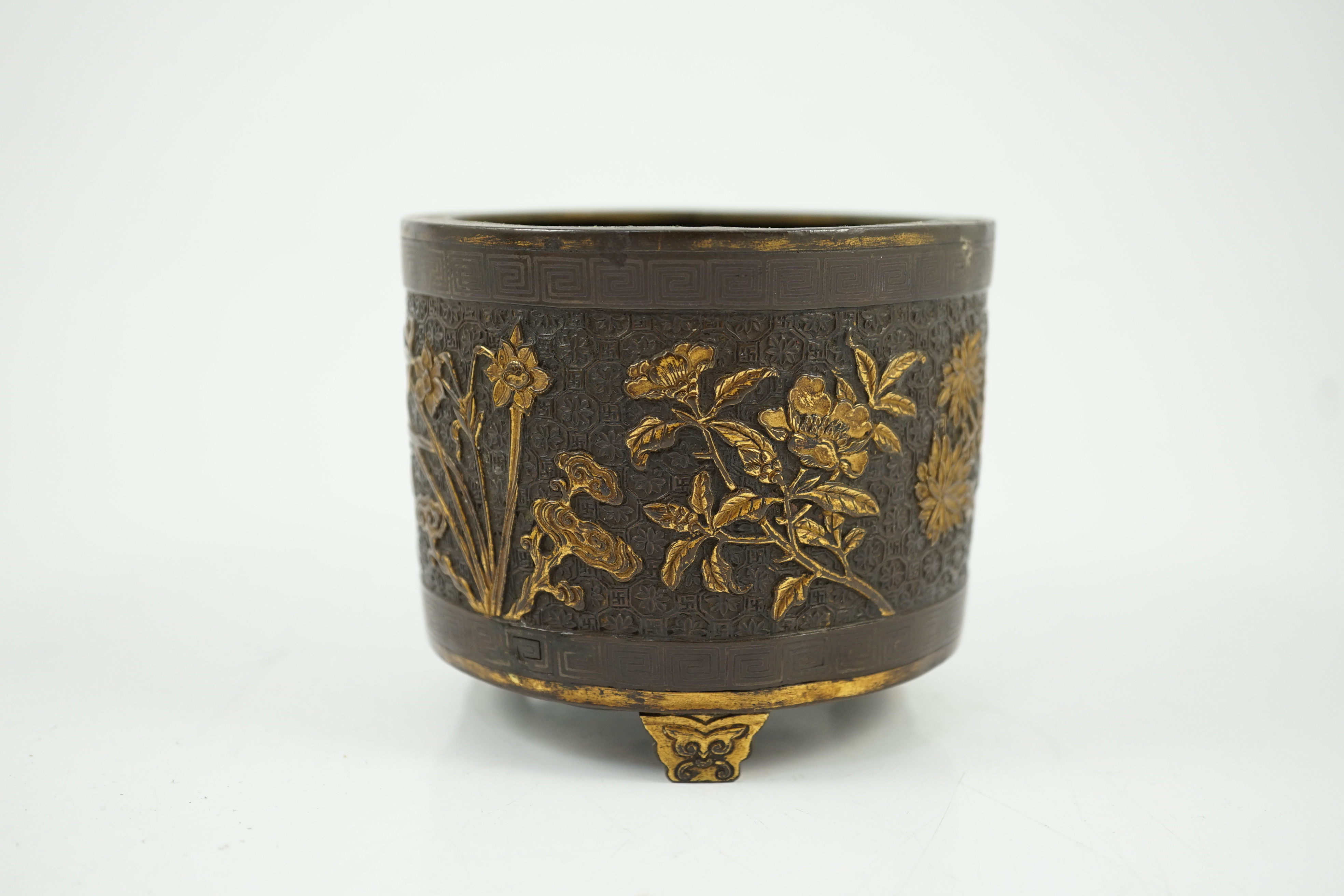 A Chinese parcel-gilt and silver inlaid bronze tripod censer, Yunjian Hu Wenming mark, 16th/17th century, small dents and three rim splits